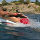 A man paddling a SWMBRD